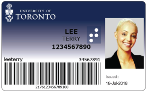 A TCard with a braille sticker. Text on the image reads: Lee, Terry with a student number.