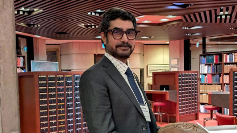 Vik Chadalawada is pictured in a library setting.