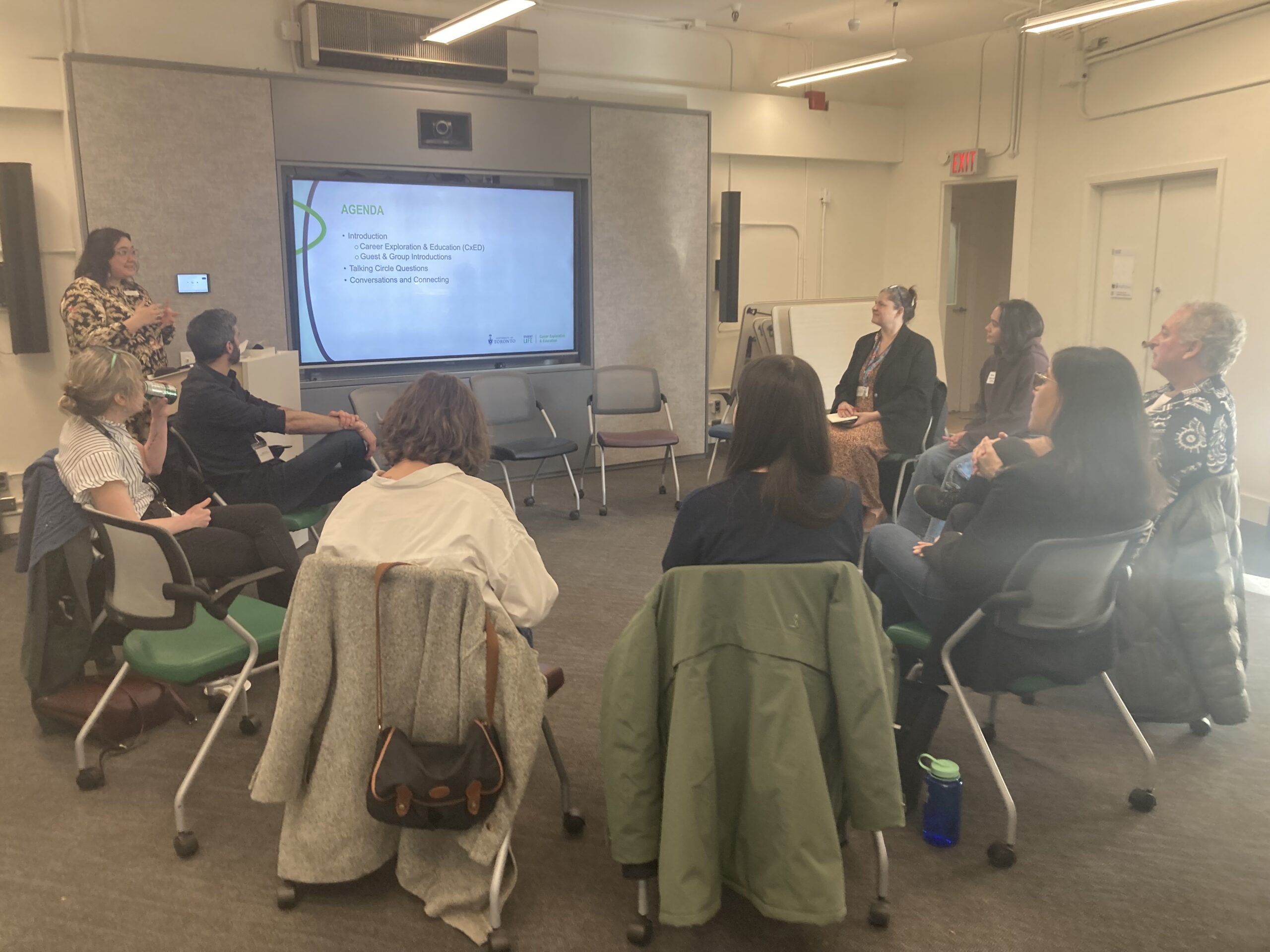 Group of students in chairs facing a screen